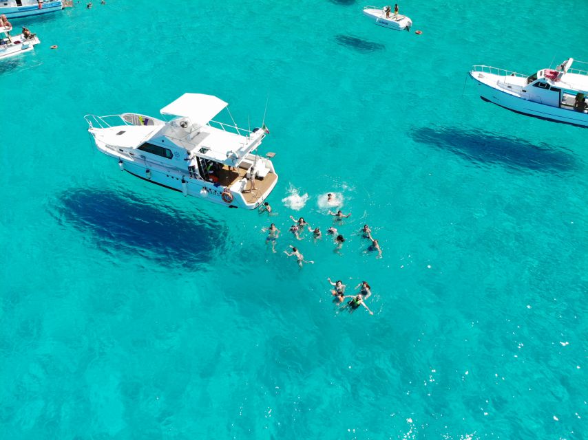 5 hours Lampedusa: Boat Tour with panino SUP e snorkeling - Snorkeling Below the Boat