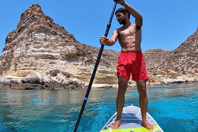 7 hours Boat trip to Lampedusa lunch, SUP and Snorkeling - The migration monument on the way back