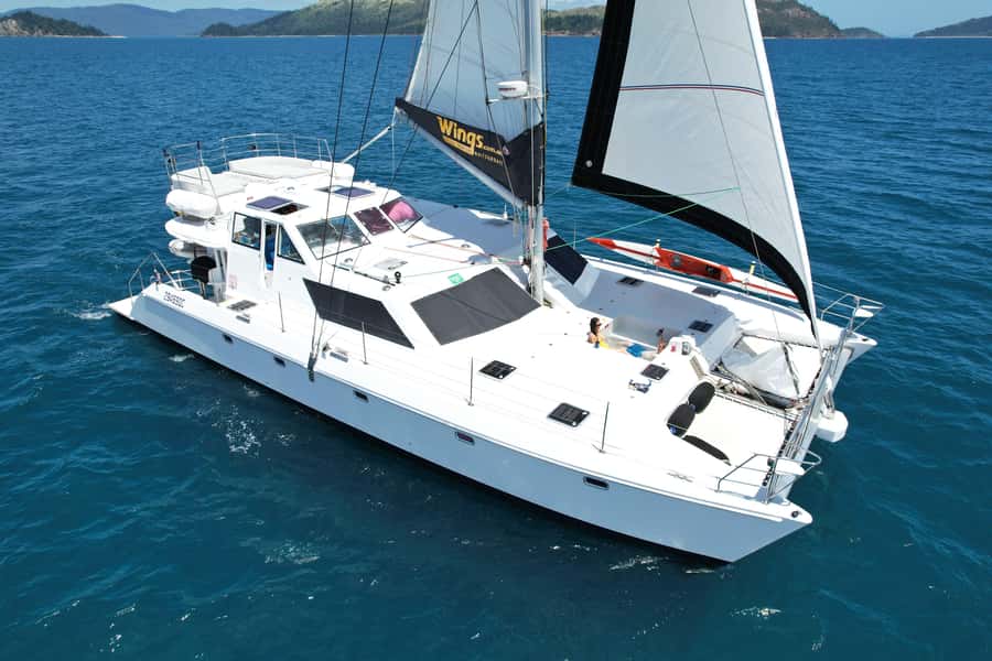 Airlie Beach: Whitsunday Islands Sailing, SUP & Snorkel Tour - Why Wings III feels different from a standard island cruise