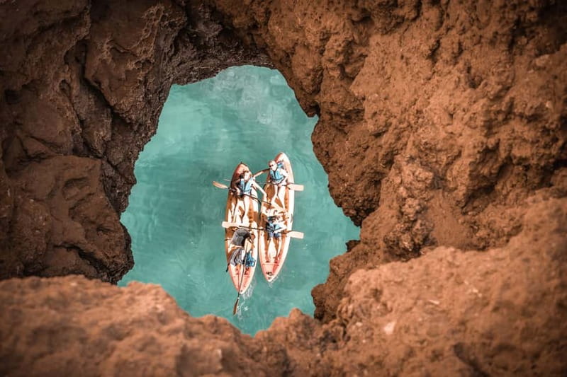 Albufeira: Hidden Beaches & Cliffs Guided Kayak Cave Tour - Praia da Coelha and the first cliff views
