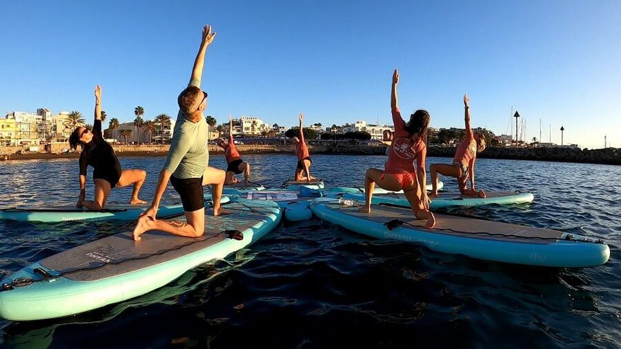 Arguineguín: Stand-up Paddleboard Yoga Class with Instructor - Moving through yoga on open water