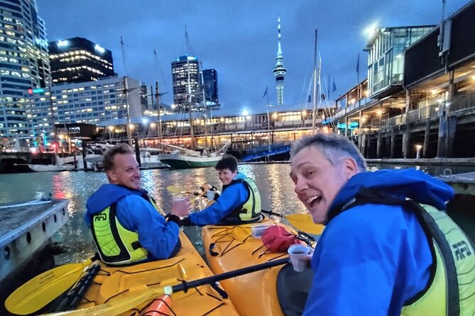 Auckland City Lights Night Kayaking Tour - Looking up at the Sky Tower after dark