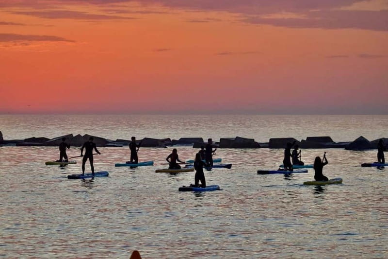 Barcelona: Paddleboarding at Sunrise. Includes: instructor, photos, equipment - From the school to the water