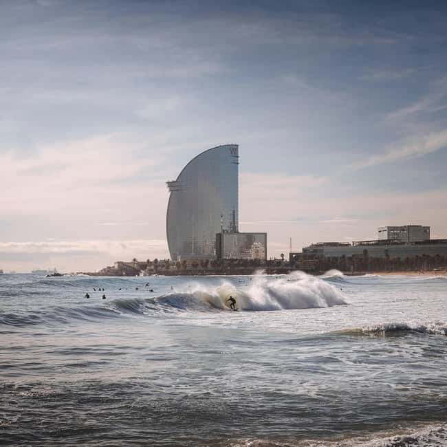 Barcelona: Sunrise or Sunset Paddle Surf with Photos - What the experience feels like for beginners