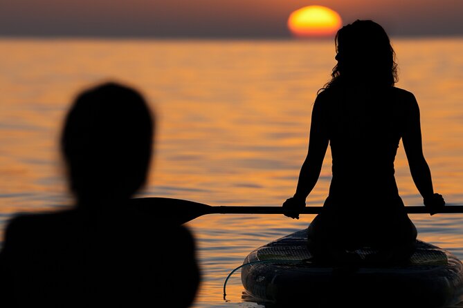 Barcelona: Sunrise Paddle Surf with Instructor and Photos - Carrying the board to Barceloneta Beach