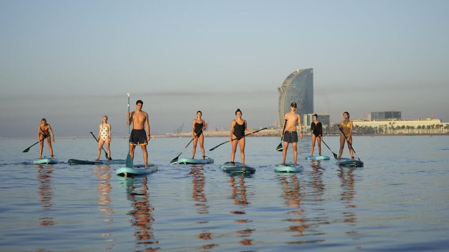 Barcelona: Sunrise Paddleboarding with Instructor and Photos - From Eswell Surf School to the sand