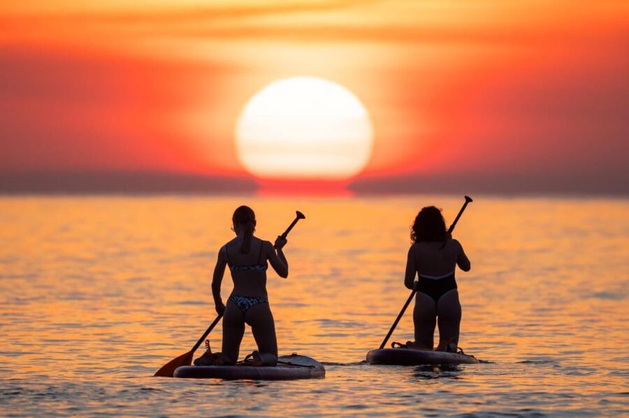 Barcelona: Sunrise Paddleboarding with Instructor and Photos - Booking flexibility and weather decisions