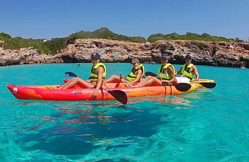 Binibèquer: Kayaking, Caves and Snorkeling Adventure - Passing Binibeca Vell from the water