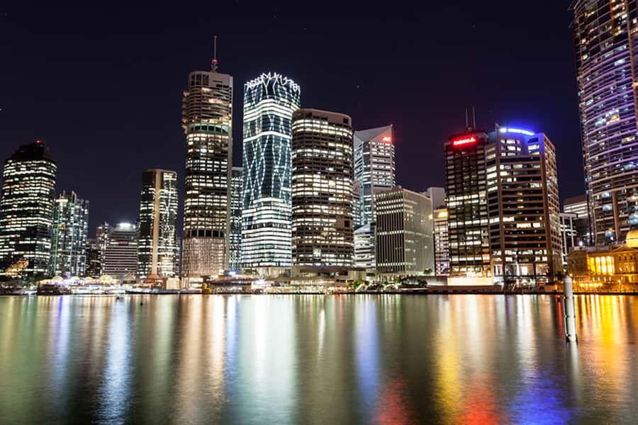 Brisbane: Illuminated River Night Kayak Tour - Brisbane from water level after sunset