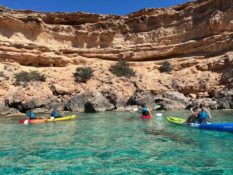 Cala Codolar: Sea & Caves Kayaking Tour with Snorkeling - Paddling past cliffs and cave entrances