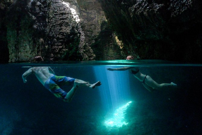 Cave exploring by kayak - Leaving the kayak to enter the cave