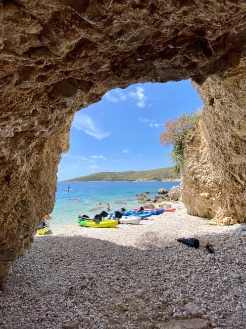 Caves of Porto Palermo: Kayak/SUP Tour with Castle Sea View - Across the bay to cliffs and another beach