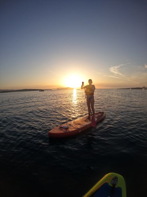 Chania: Stand-up Paddleboard Coastal Sunset Experience - Learning to stand before the sun drops