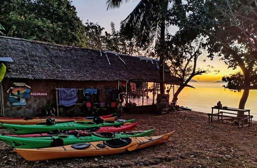Coron: Coron Island Sunset Kayaking trail - Paddling the channel between Coron Town and Coron Island