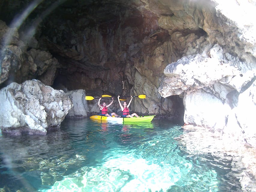 Dénia: Kayak and Snorkeling Tour in Cova Tallada - Entering Cova Tallada with a flashlight