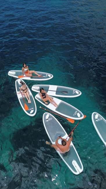 Experience Crystal paddle surf Tours + snorkel - Starting at Cala Llonga, or another weather-friendly beach