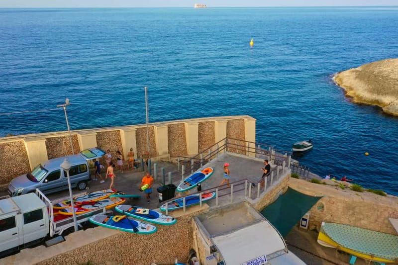 Explore Malta’s Blue Grotto by SUP - Paddling along Blue Grotto Bay