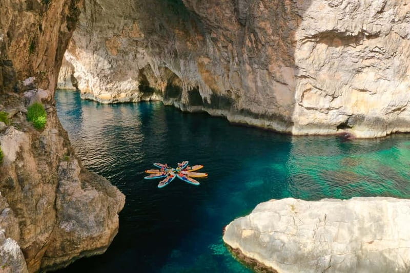 Explore Malta’s Blue Grotto by SUP - Swimming in clear water before the boats arrive