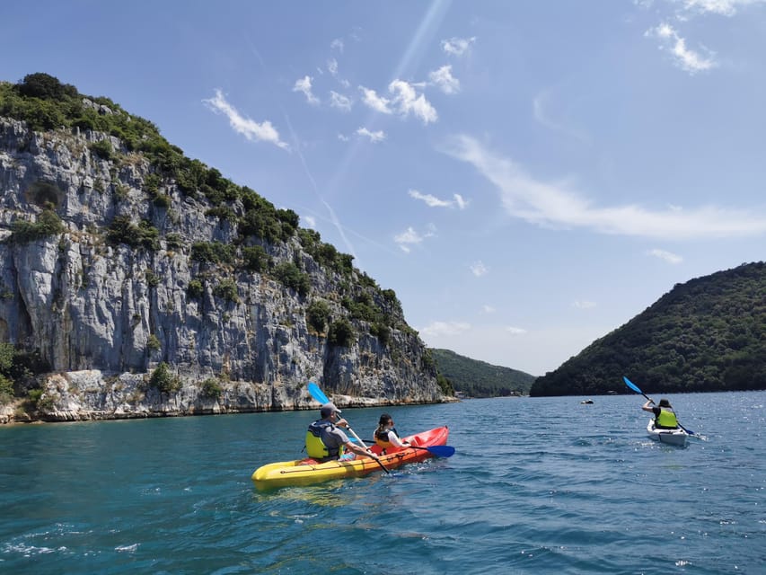 From Poreč: Lim Bay Sea Kayaking Day Trip - The rocky beach and swim break