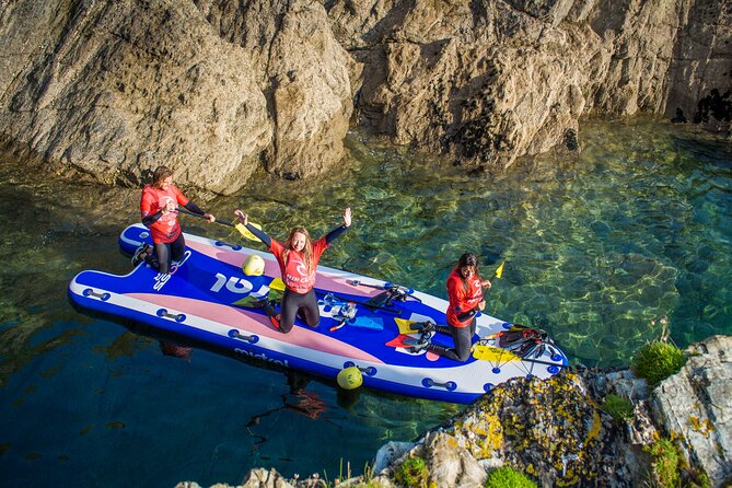 Giant Stand Up Paddle Boarding Experience in Newquay - A giant board turns paddling into a team sport