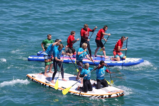 Giant Stand Up Paddle Boarding Experience in Newquay - Following the coast toward coves and caves