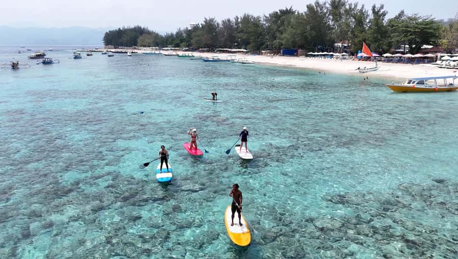 Gili SUP Or Kayak With Drone Shoot . Daylight Or Sunrise - Paddling over Gili Trawangan’s clear water