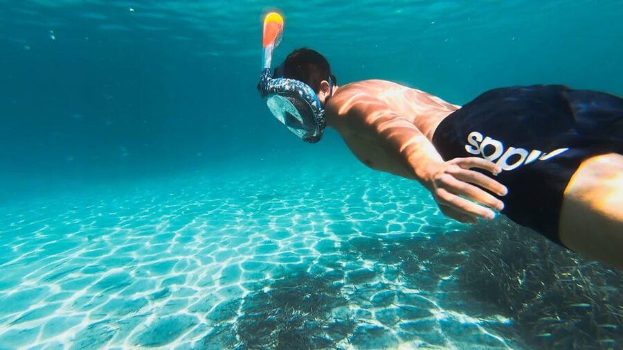 Golfo Aranci: Sunset Dolphin Kayak Tour with Aperitif - Paddling out from Spiaggia dei Baracconi