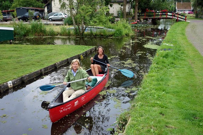 Guided Canoe Adventure with Picnic Lunch in Waterland from Amsterdam - Paddling through reedbeds, bridges, and village country