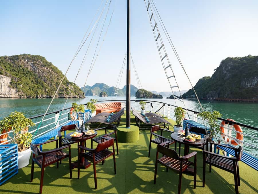 Halong Bay: Day Cruise with Caves, Kayaking & Sunset Party - Titop Island for swimming, photos, or the summit