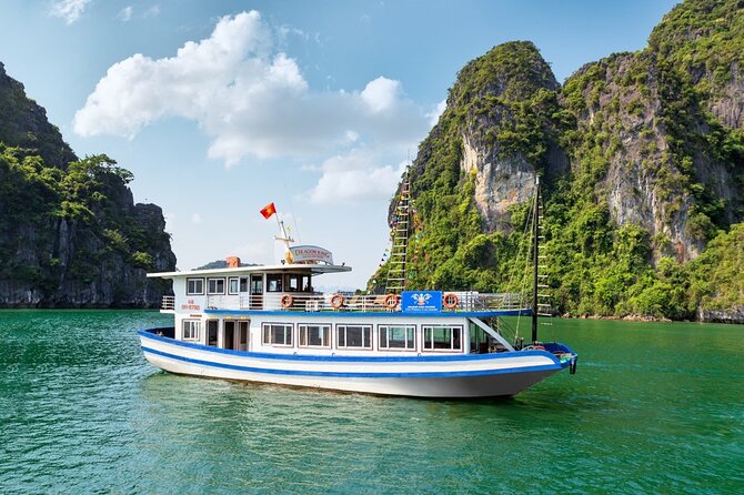 Halong Bay Day Tour With Titop Island, Cave, Kayak & Lunch - Walking through Sung Sot Cave