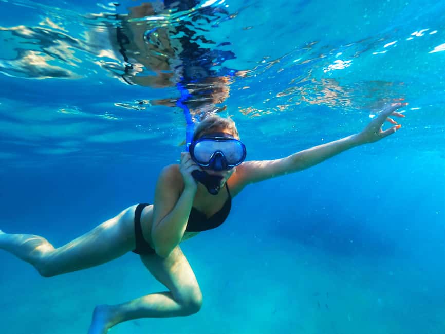 Ibiza: Snorkeling and SUP Paddle, Beach and Cave Tour - Cala Bassa: rocks, sand, and underwater life