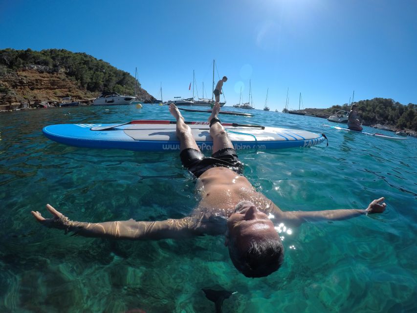 Ibiza: SUP & Snorkel Boat Tour with Caves, Drinks & Photos - Tapas, fruit, and photos on the boat