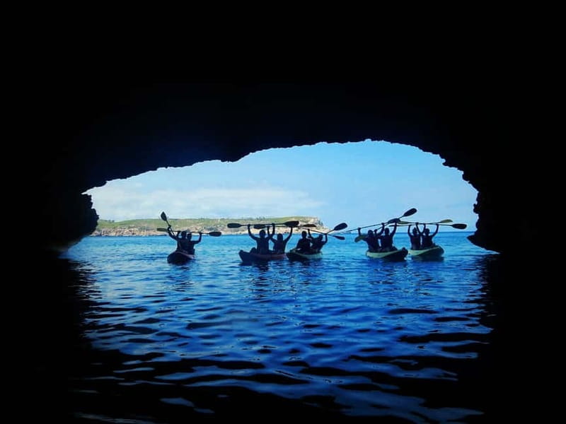 Ibiza: Xarraca Bay Guided Kayaking Tour - Paddling between islets toward the marine caves