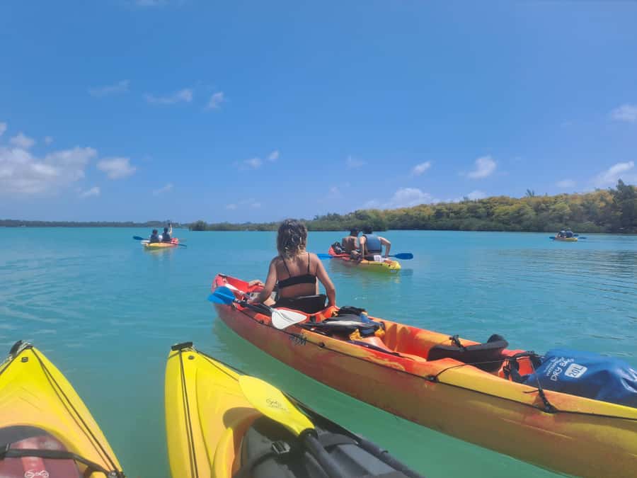 Ile d Ambre Kayaking - Slaloming past pirogues toward the park