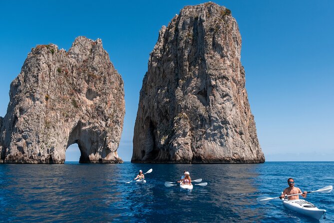Kayak tour in Capri between caves and beaches. Photos included. - Passing beneath Arco della Stella
