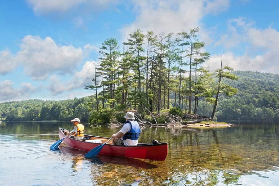 Lapland: Canoeing Trip with Reindeer and Husky Farm Tour - Canoeing on a quiet forest lake