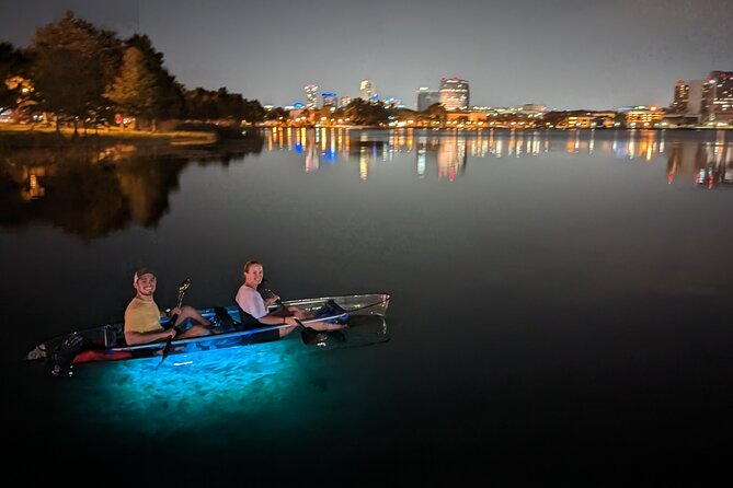 LED Glow in the Dark Clear Kayak or Paddleboard in Paradise - Sunset, city lights, and the glowing boats