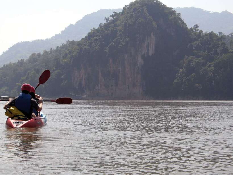 Luang Prabang: Kayak Tour to Pak Ou Caves - Arriving at Pak Ou Caves by kayak