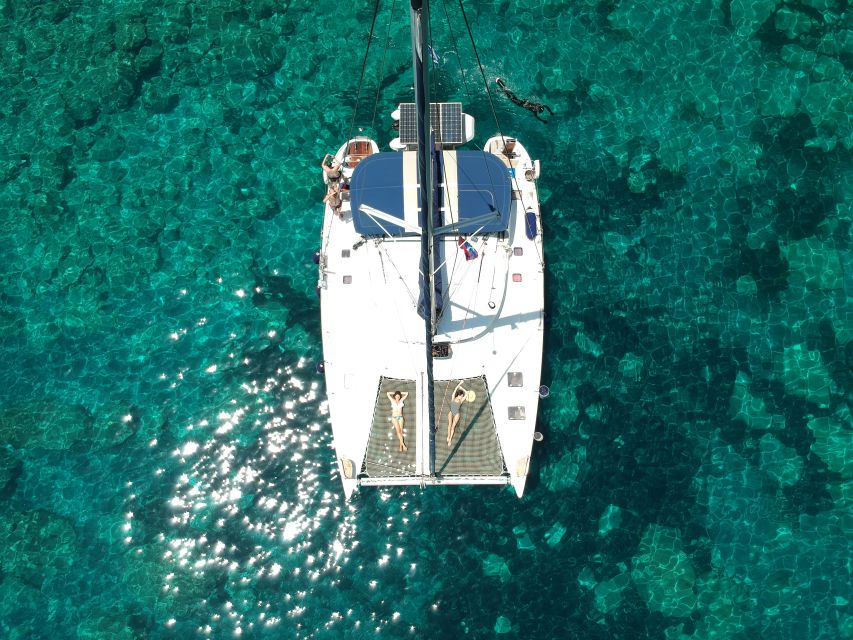 Milos: Full-Day Catamaran Cruise with Paddle Board - From Adamas to Klima and Cape Vani
