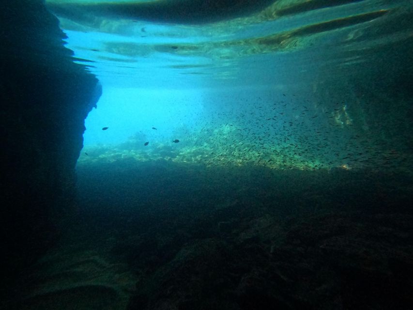 Naxos: Rhina Cave and Coastline Sea Kayaking Tour - Local snacks beside the cave
