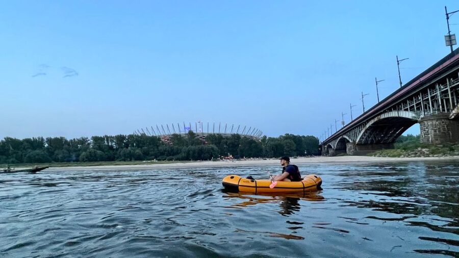 Packrafting kayaking guided tour Vistula river Warsaw Poland - The possible island stop and sunset over Old Town