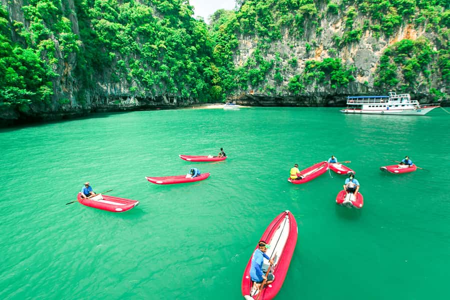 Phang Nga Bay Highlights: Kayaking and Cave Exploration Tour - Entering the sea caves by guided kayak