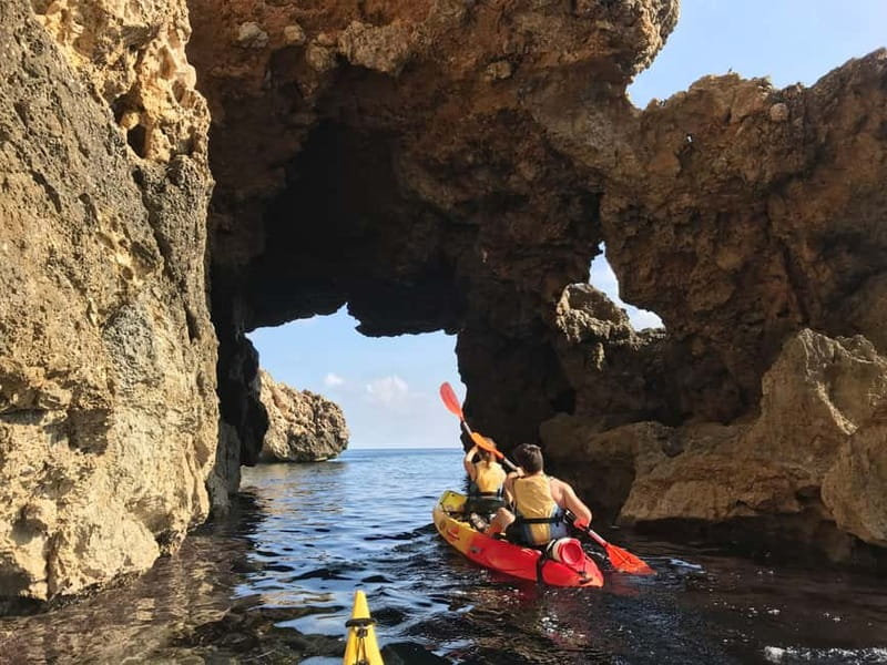 Pollença: Kayak Discovery – Snorkeling and Caves - Paddling beneath the high cliffs
