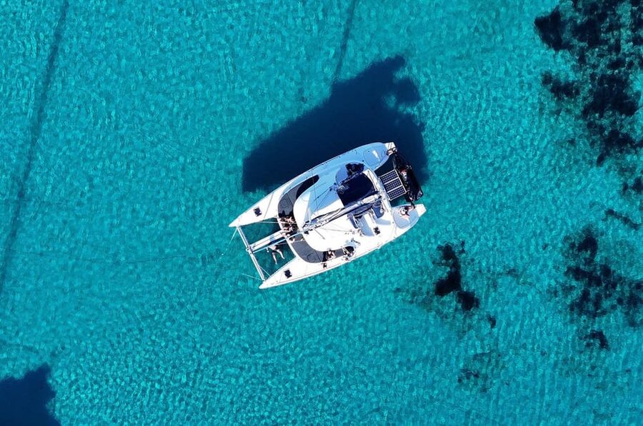Private Catamaran Cruise Mykonos Delos with Meals & SUP - Leaving Mykonos for Delos and Rhenia