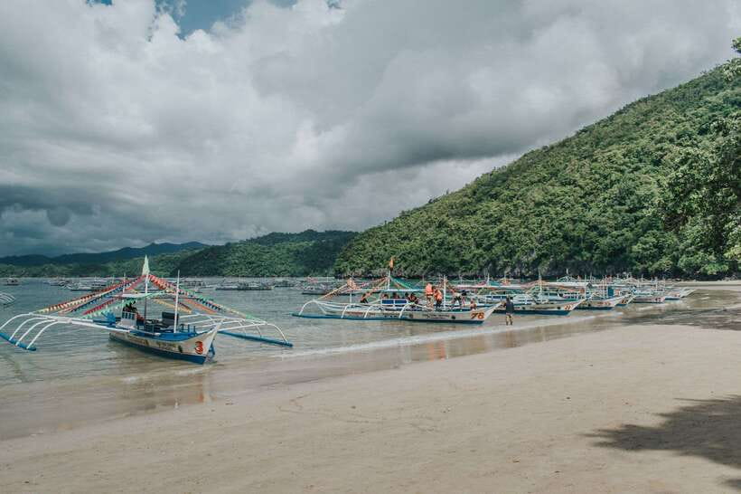 Puerto Princesa: Underground River, Zipline, Paddleboat Tour - Filipino lunch at Sabang Beach