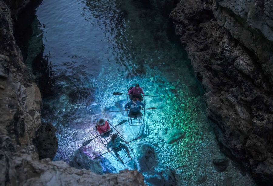 Pula: Night-Time Sea Kayaking Tour in Transparent Kayak - Looking through the illuminated kayak