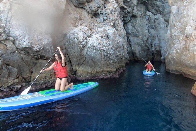 Santorini: Stand-Up Paddle and Snorkel Adventure - Paddling beside Santorini’s cliffs