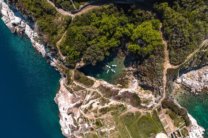 Small group paddle boarding tour to Bagni Regina Giovanna - Punta del Capo and the Roman remains
