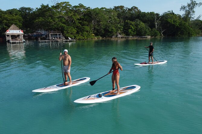 Sunrise on Paddleboard with breakfast in the lagoon of 7 colors - The Black Cenote adds contrast
