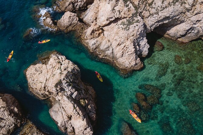 Tossa de Mar: Kayak & Snorkel Tour with Paella from Barcelona - Three hours among cliffs, coves, and sea caves